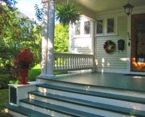 Front entry with columns and balustrade