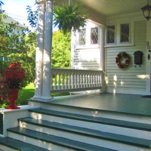 Front entry with columns and balustrade