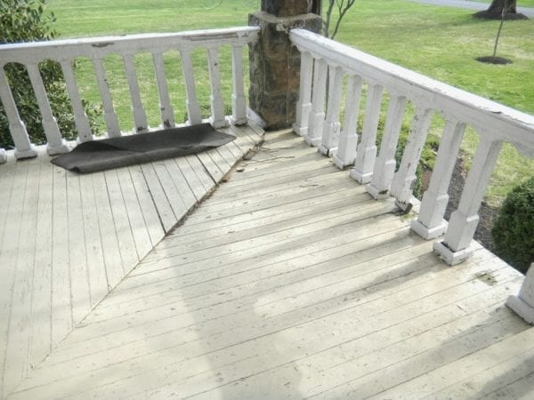 Before picture of rotted porch railings