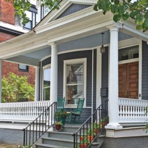 Victorian spindles on a front porch with fluted columns