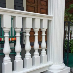 Victorian porch spindles and cedar railing with fluted columns