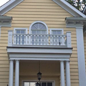 Covered entry with classic spindles and railing