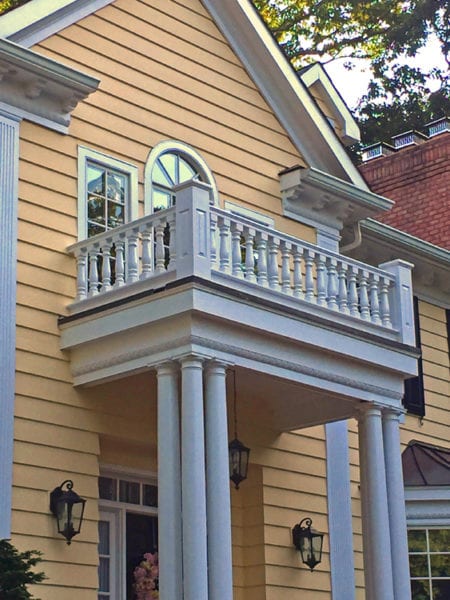 Covered entry with baluster railings