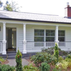 Porch railing with recessed panel column pedestals