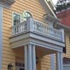 Covered entry with railings and columns
