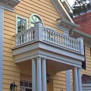 Covered entry with railings and columns