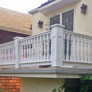 Classic balcony spindles and recessed panel newel posts and caps