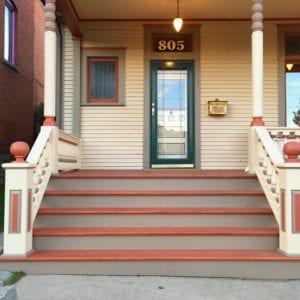 Front entry steps with raised panel newel posts and balustrade