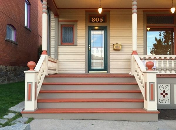 Front entry steps with raised panel newel posts and balustrade