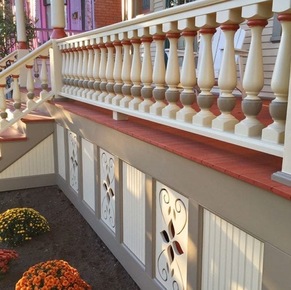 Front porch with large porch spindles and railing