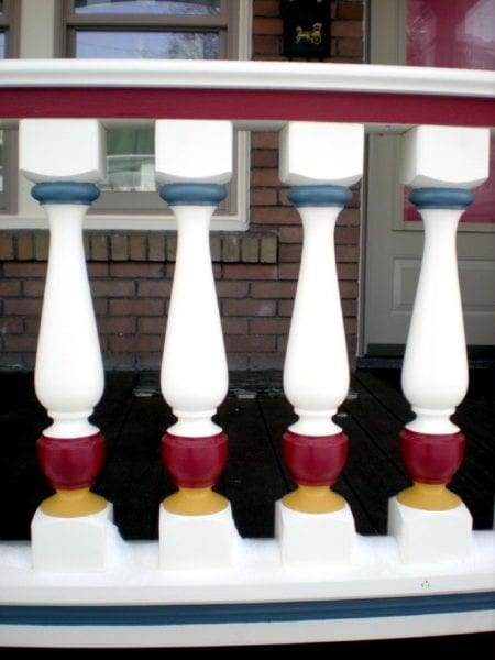 Paint porch railing. Multi colored Revival porch spindles