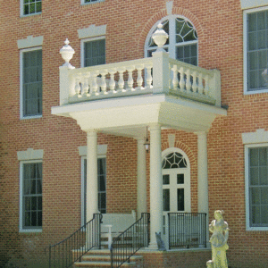 Covered entry with synthetic balustrade