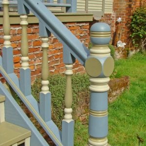 Custom front entry stair entry with turned newel post and turned spindles