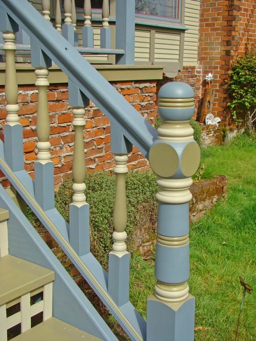 Custom front entry stair entry with turned newel post and turned spindles