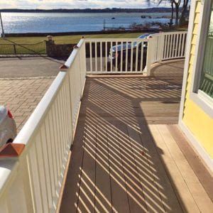 Deck railing in MA featuring square balusters