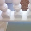 notched spindles on exterior sloped bottom rail