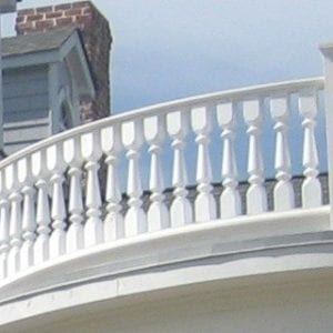 Tuscan porch railing spindles and curved rail