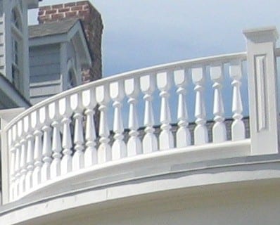 Tuscan porch railing spindles and curved rail