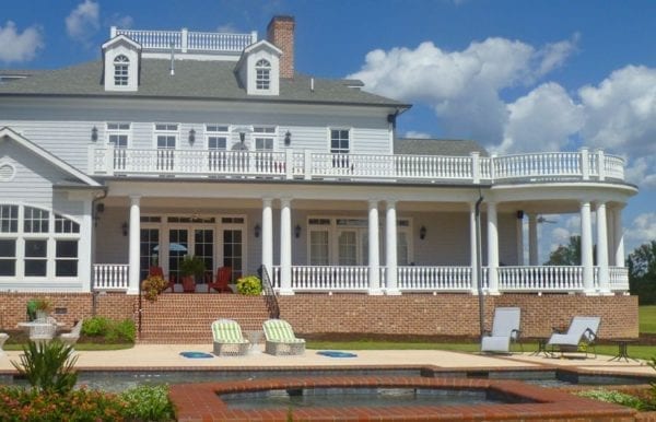 Tuscan porch spindles, raised panel newel posts, and columns