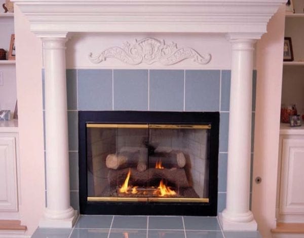 Round tapered columns used on fireplace mantle